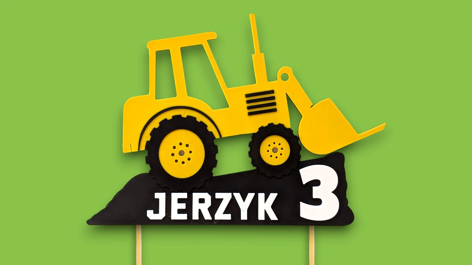 Topper na tort koparka z imieniem na zielonym tle – kontrastowa dekoracja urodzinowa