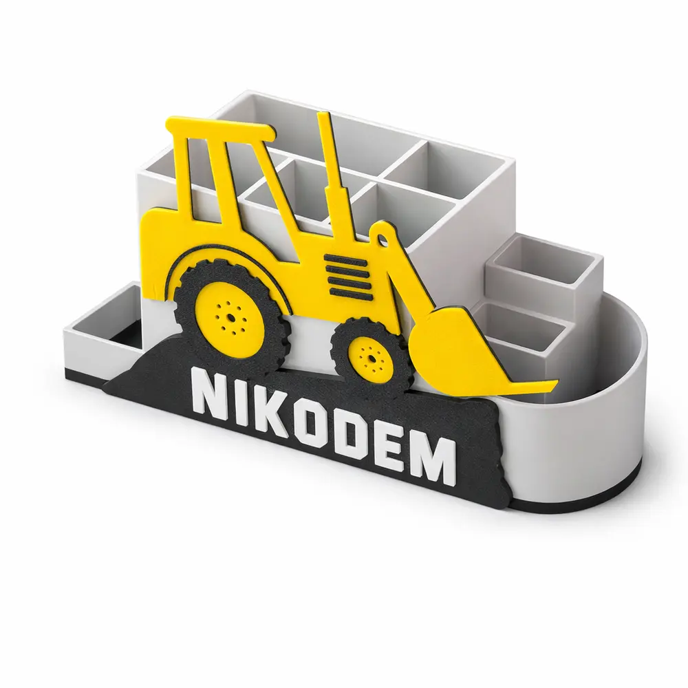 Pusty organizer na biurko koparka z imieniem Nikodem. Widok z boku pokazujący układ i głębokość przegródek na przybory szkolne.